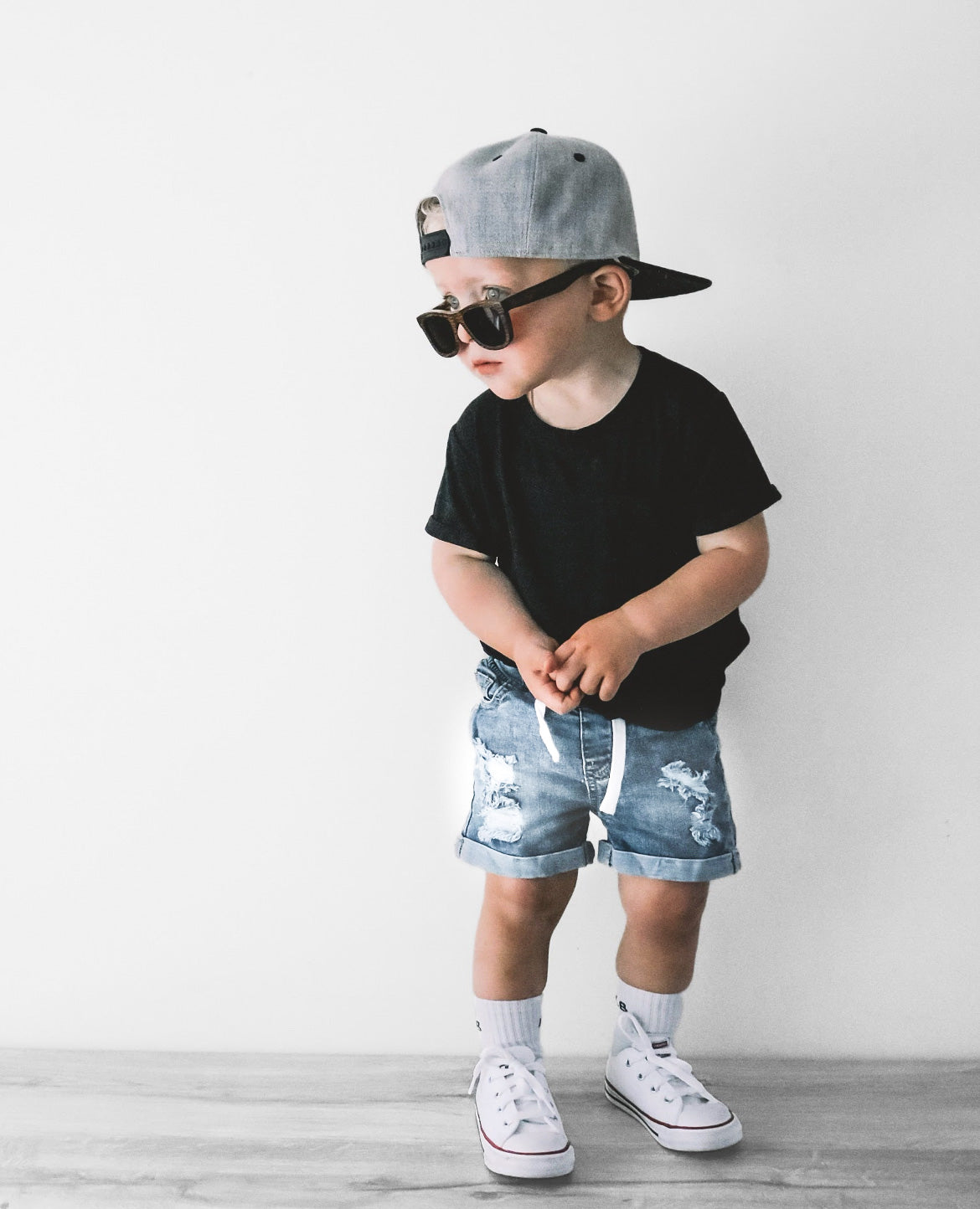 toddler in kids basic outfit with distressed denim shorts