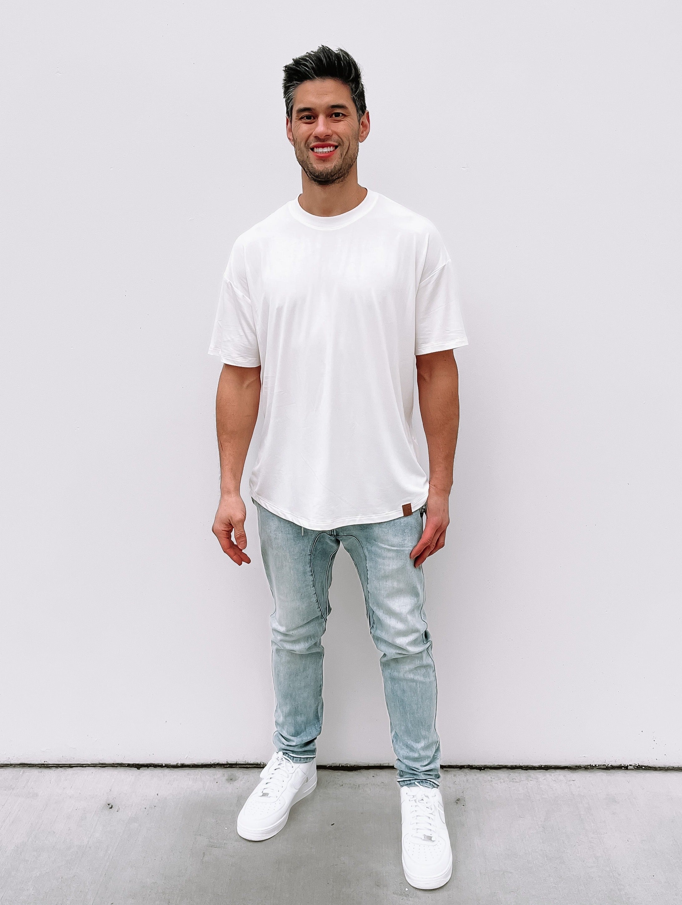 Man in oversized white bamboo tee