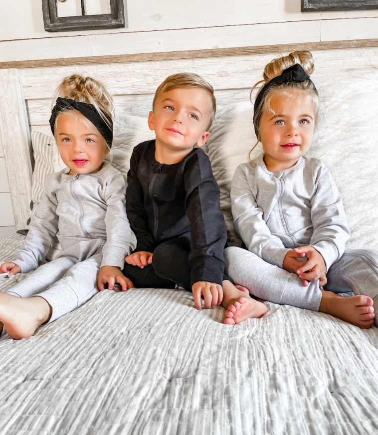 Three toddlers in Little Bipsy onesies