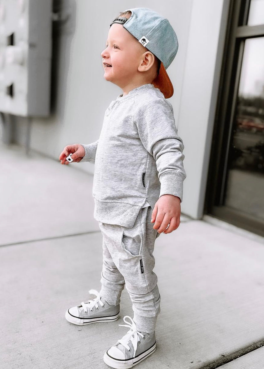 toddler street style outfit with toddler grey joggers and toddler grey pullover. toddler sweat set