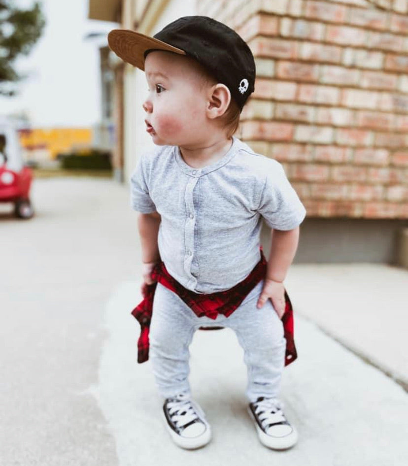 Baby in button up kids romper