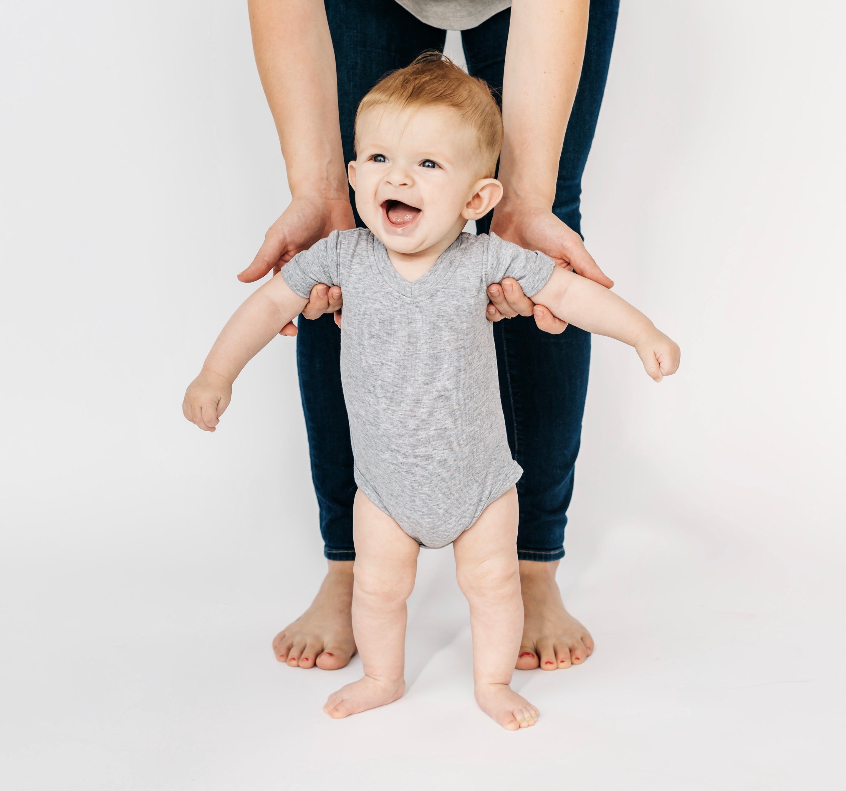 Baby in basic onesie in grey